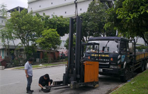 Merah Engineering technician performing on-site forklift repair in Singapore